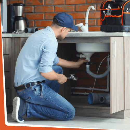 plumber fixing sink